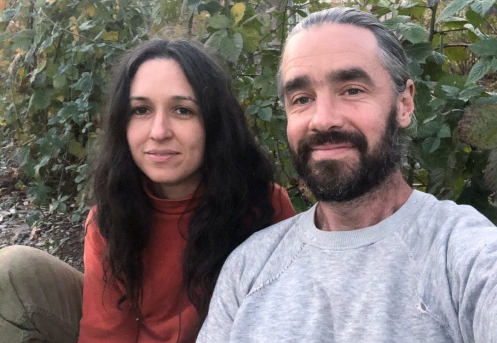 Owners of Edible farm, looking into the camera. 