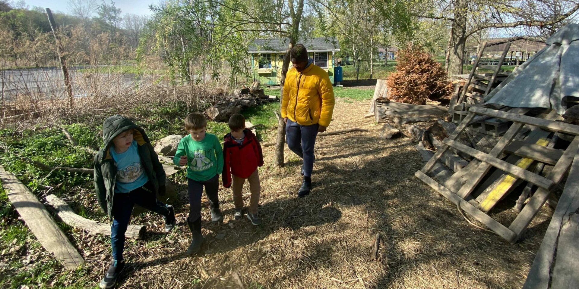 Kenley and 3 children walk in line