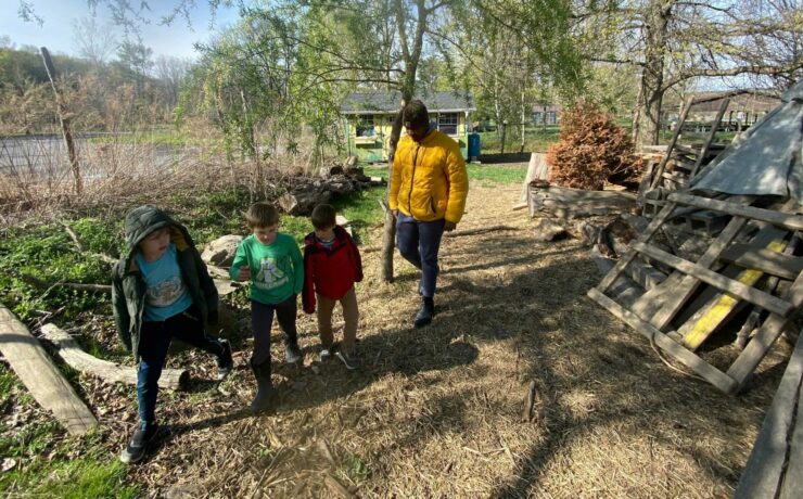 Kenley and 3 children walk in line
